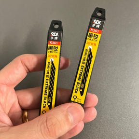 Lâmina SDI Black 9mm com Ângulo de 30° – Corte Fino e Preciso (Caixa com 10 Lâminas)